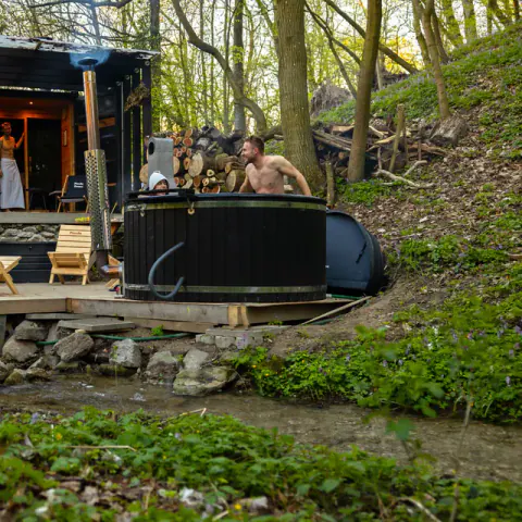 Pixxla forest sauna with a hot tub.