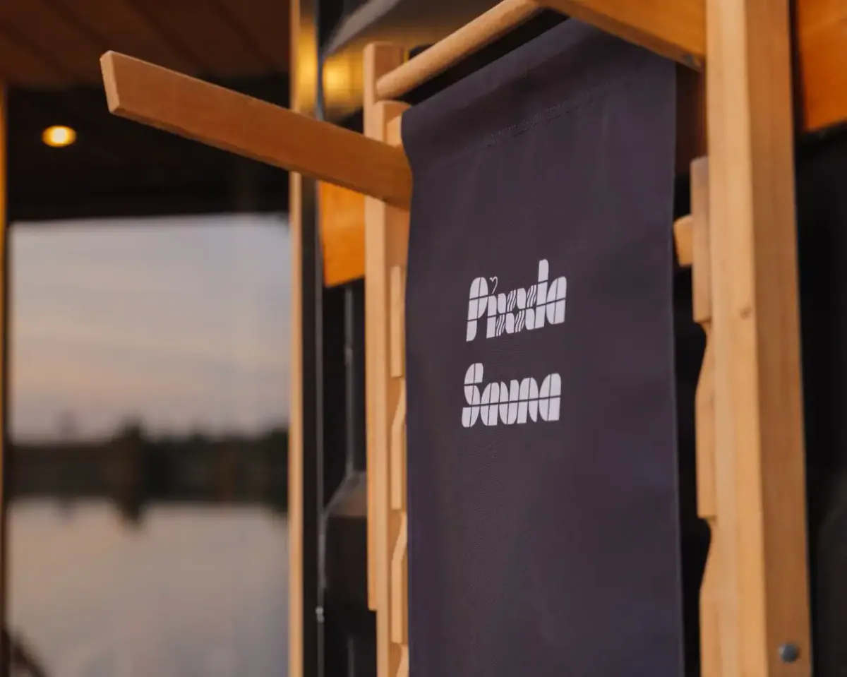 Wooden bench inside the Pixxla sauna at Vajnory Lakes.
